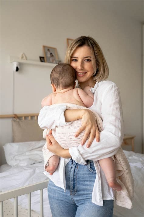 Woman Holding Baby Photos, Download The BEST Free Woman Holding Baby ...