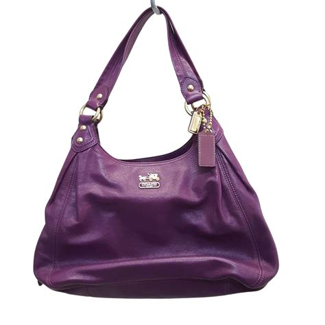 Coach Purple Leather Women's handbag with Gold hard ware (s)
