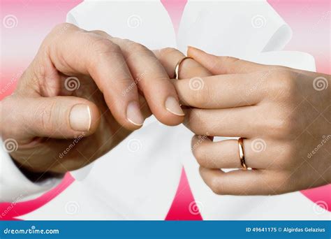 Woman S Hand Putting on a Wedding Ring on a Man S Finger Stock Image ...