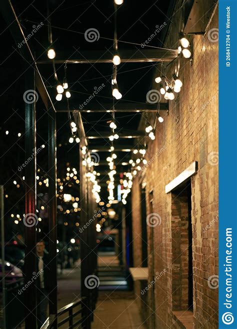 Vertical View of a Street-side Passage Designed with Light Bulbs at ...