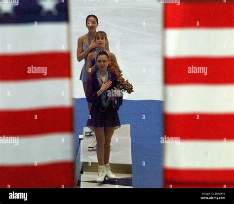 Medalists Michelle Kwan, back, Tara Lipinski, center, and Chen Lu ...