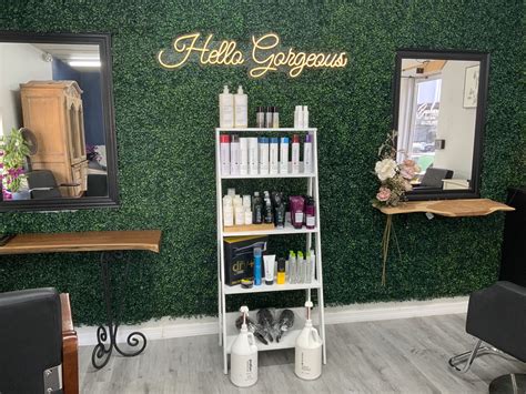 Hello Gorgeous Hair Salon with Green Wall and White Shelving