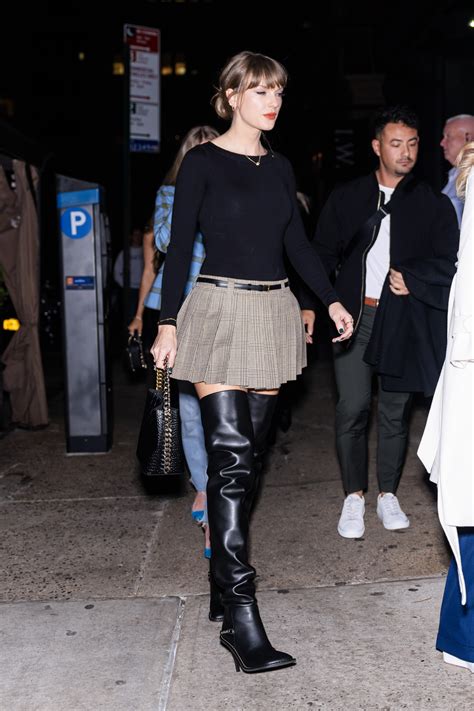 Taylor Swift pairs pleated miniskirt with sexy thigh-high boots for girls’ night out in NYC