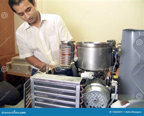 Image result for An Engineer Fixing Machine