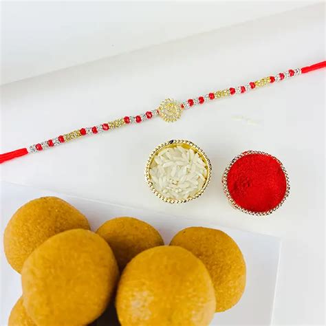 Send Om Rakhi With Besan Ladoo Online | Rakhibazaar.com