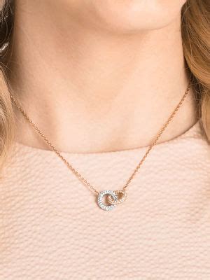 Buy SWAROVSKI Rose Gold Plated Intertwined Circles White Dextera ...