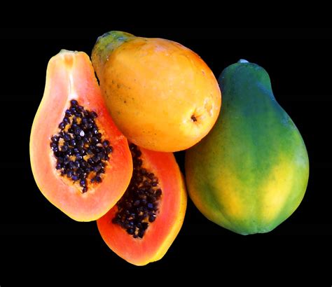 Download Whole And Sliced Papaya Fruits Wallpaper | Wallpapers.com