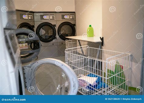 Row of Front-loading Washers in a Laundry Facility Stock Photo - Image ...