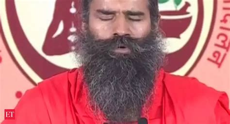 Hundreds followed as Baba Ramdev performed yoga asanas - The Economic ...