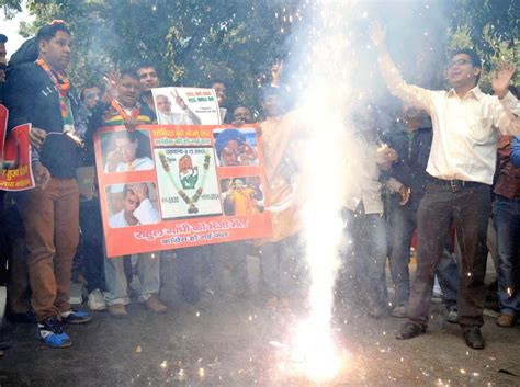 BJP supporters celebrate after declaration of Delhi Assembly Polls results