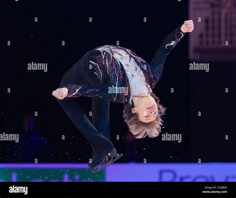 Ilia Malinin does a backflip as he enters the rink for the medal ...