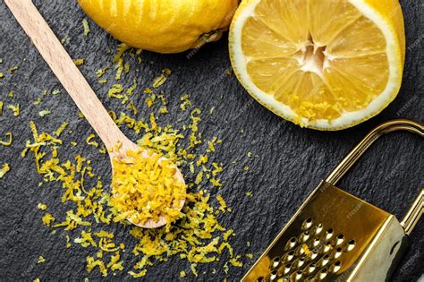 Premium Photo | Yellow organic lemons zest and special tool grater peel ...