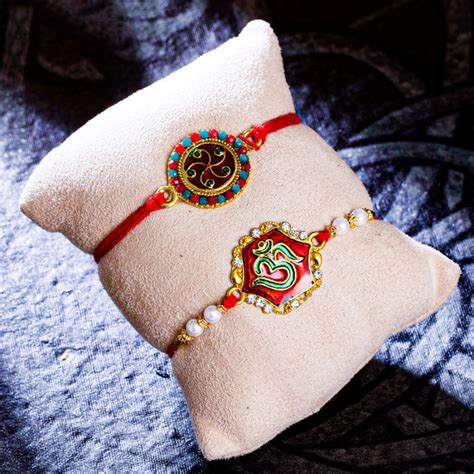 Sukkhi Ethnic Gold Plated OM Meenakari Rakhi Combo (Set of 2) with Rol ...