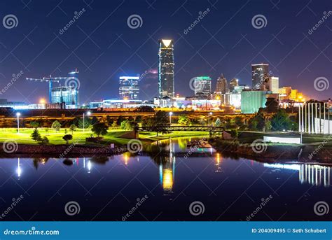Oklahoma City Skyline at Dusk with Buildings Reflected in Water Stock ...