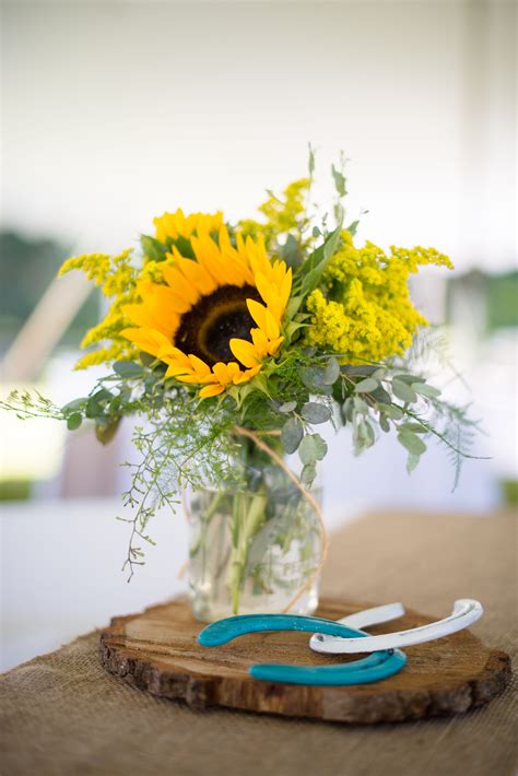 Centerpieces of Sunflowers in Mason Jars on Wood Slabs | Sunflower ...