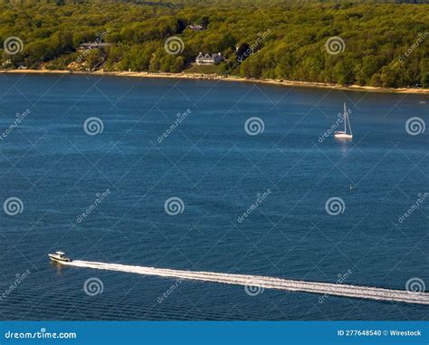 Aerial View Over the Calm Waters with a Sailboat Traveling in Oyster ...