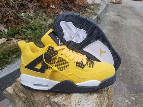 Download The iconic Air Jordan shoes in a pristine yellow color ...