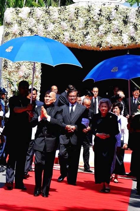 Cambodian King Norodom Sihamoni (2nd L, front) and his mother, former ...