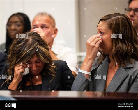 Lisa Miller, left, and her daughter, Mandi Jenkins, wipe tears from ...