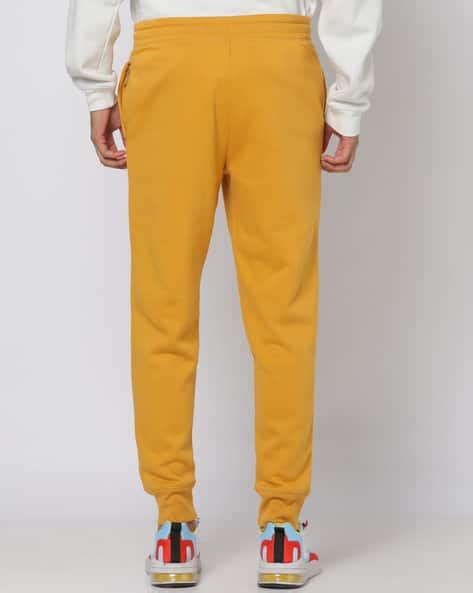 Buy Yellow Track Pants for Men by GAP Online | Ajio.com