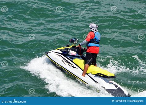 Man Standing Up on a Speeding Jet Ski Stock Photo - Image of recreation ...