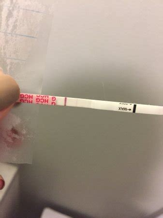 Positive wondfo or evap line? 10dpo | BabyCenter