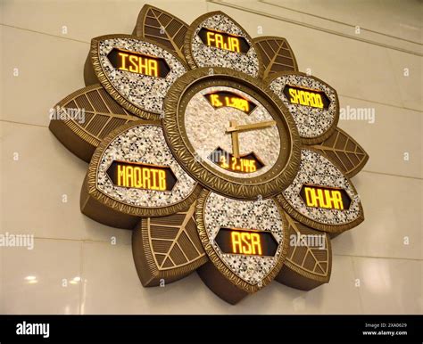 Abu Dhabi, UAE, The splendor of large decorative clock showing prayer ...