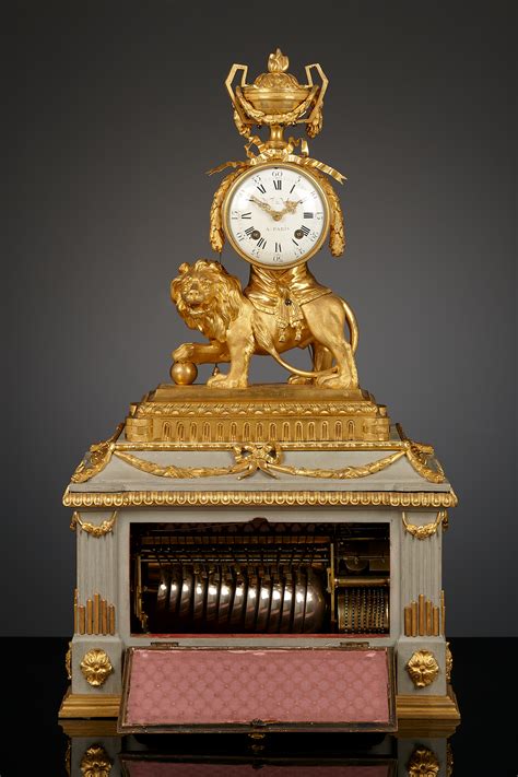 French Louis XVI lion mantel clock with musical box | ArtListings