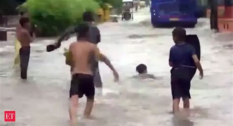 Delhi rains: Children swim amid heavily waterlogged roads following ...
