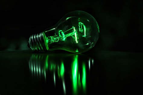 Download Green Led Light Bulb Dark Background Wallpaper | Wallpapers.com