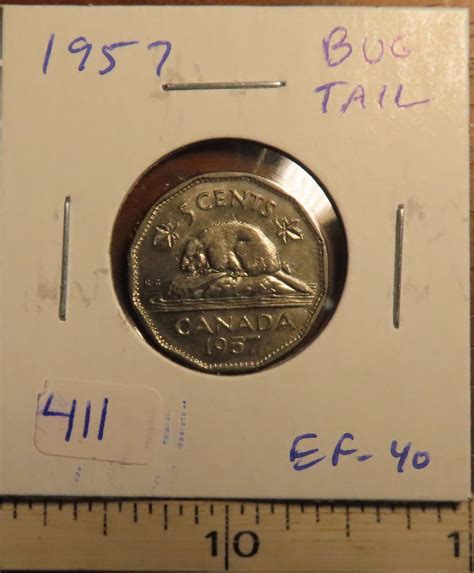 1957 Bug Tail Nickel 5 Cents. The is a Die Chip on the end of the ...