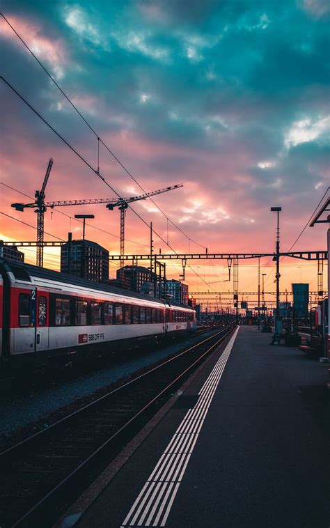 Download wallpaper 800x1280 railway, train, station, sunset, waiting ...