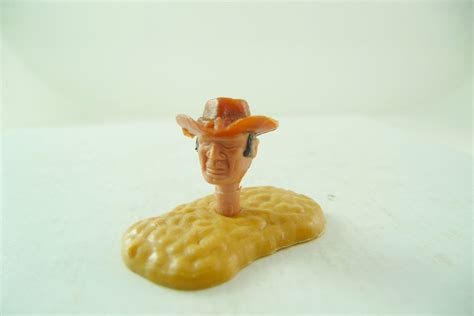 Timpo Toys Cowboy's head 3. version translucent brown hat ...