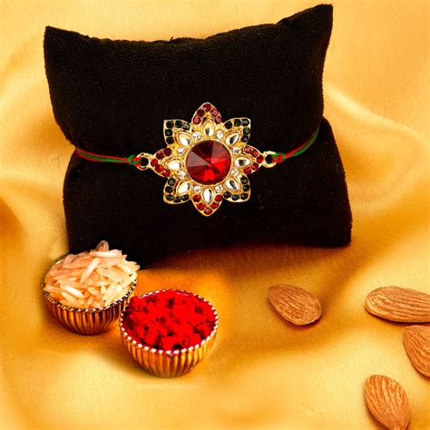 Sukkhi Incrediable Gold Plated Floral Rakhi Combo (Set of 2) with Roli ...