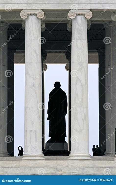 Vertical Shot of the Silhouette of the Thomas Jefferson Statue and Tourists at the Jefferson ...