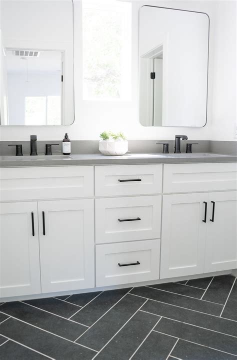 Gray and White Bathroom with Herringbone Floors | Gray and white ...