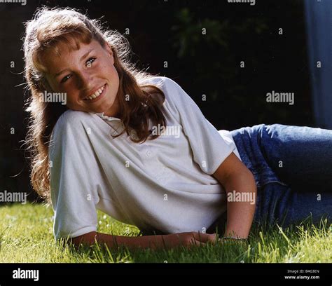 Juliette Carton actress wearing jeans lying in grass Stock Photo - Alamy