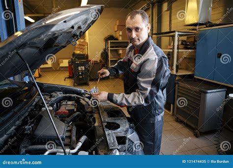 Portrait of a Smiling Fixing a Car Engine in His Garage Stock Image ...