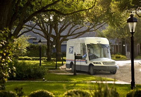 U.S. Postal Service (USPS) trucks are parked at a post office on August 23, 2024 in Glendale, Califo