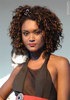 And Black Hair Style by Waves That Touch The Temples Bouffant Ruffled Curls And Black Hair Style