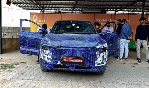 Upcoming 202Mahindra XUV.e9 Electric Coupe SUV Spotted At A Charging ...