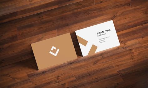 Business card and logo mockup on wood | Premium PSD