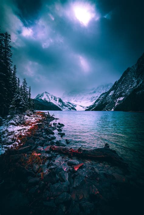Download wallpaper 4016x6016 mountains, lake, fog, snow, stones ...