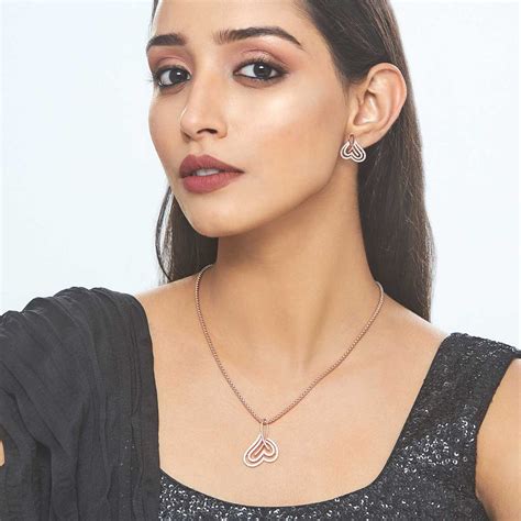 Rhodium Plated Pendant Earrings Set with Wavy Heart Design