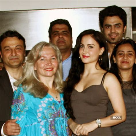 Elli Avram (2nd R) with family and Mickey Virus co-star Manish Paul ...