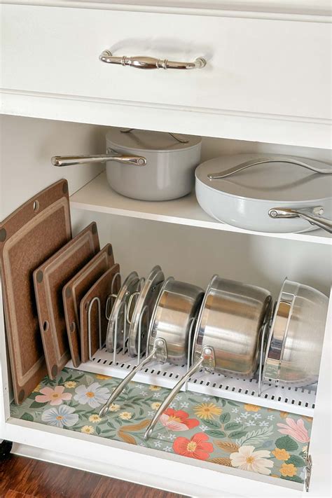 How to Organize Pots and Pans in Kitchen Cabinets - Caitlin Marie Design