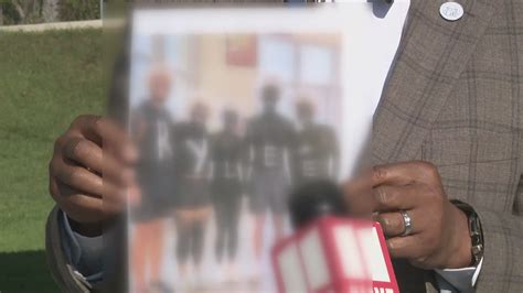 Photo taken at high school game shows individuals painted in black, causing outrage | 11alive.com