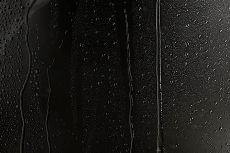 Water texture background, rainy window at night | Free Photo