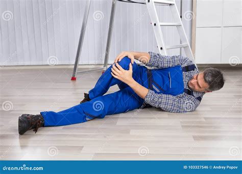 An Injured Man Holding His Leg Stock Photo - Image of accidental, holding: 103327546