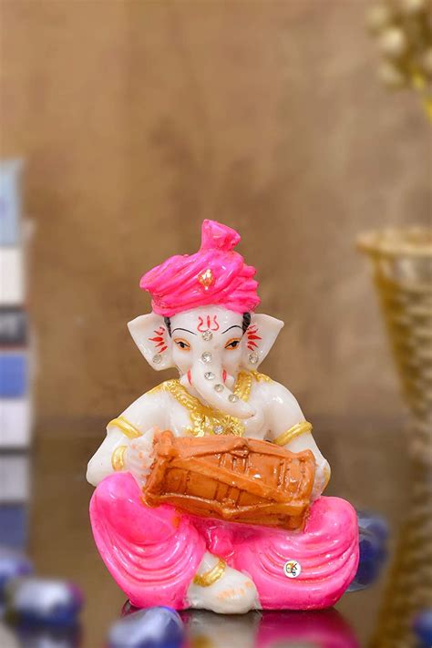 Buy Polyresin Pink Dhoti and Turban Ganesha Playing Musical Instrument ...